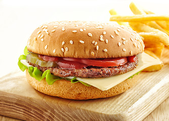 Image showing burger on wooden cutting board