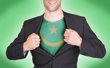 Image showing Businessman opening suit to reveal shirt with flag