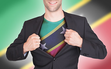 Image showing Businessman opening suit to reveal shirt with flag