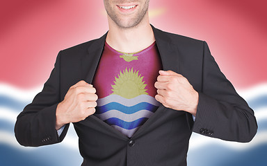 Image showing Businessman opening suit to reveal shirt with flag