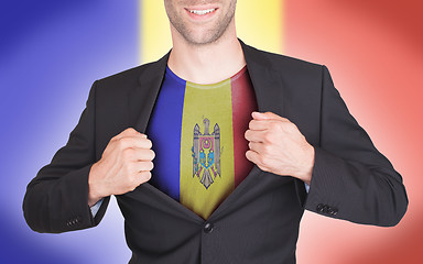 Image showing Businessman opening suit to reveal shirt with flag