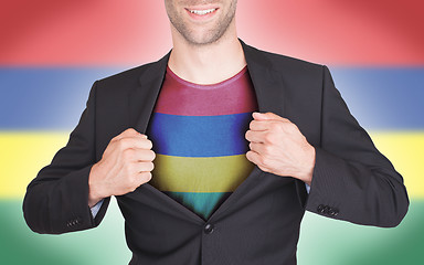 Image showing Businessman opening suit to reveal shirt with flag