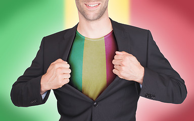 Image showing Businessman opening suit to reveal shirt with flag