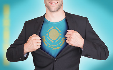 Image showing Businessman opening suit to reveal shirt with flag