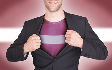 Image showing Businessman opening suit to reveal shirt with flag