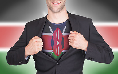 Image showing Businessman opening suit to reveal shirt with flag