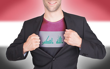 Image showing Businessman opening suit to reveal shirt with flag