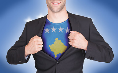 Image showing Businessman opening suit to reveal shirt with flag