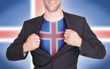 Image showing Businessman opening suit to reveal shirt with flag