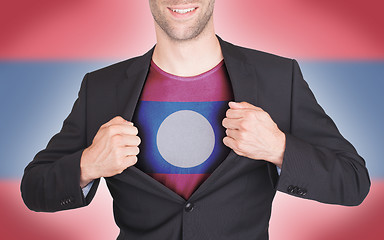 Image showing Businessman opening suit to reveal shirt with flag