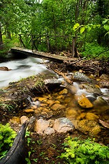 Image showing walking bridge over flowing stream