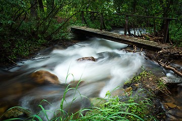 Image showing walking bridge over flowing stream