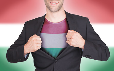 Image showing Businessman opening suit to reveal shirt with flag