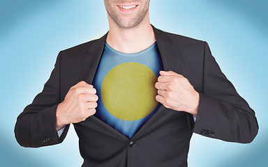 Image showing Businessman opening suit to reveal shirt with flag