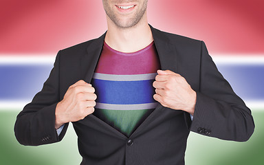 Image showing Businessman opening suit to reveal shirt with flag