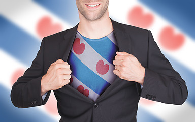 Image showing Businessman opening suit to reveal shirt with flag