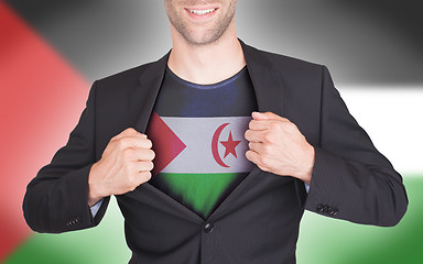 Image showing Businessman opening suit to reveal shirt with flag