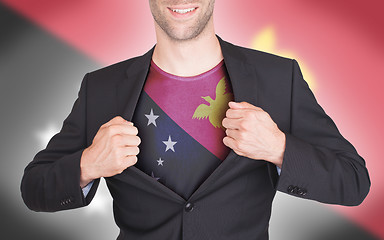 Image showing Businessman opening suit to reveal shirt with flag