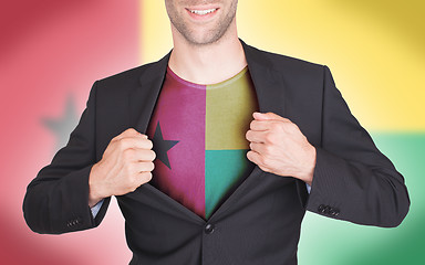 Image showing Businessman opening suit to reveal shirt with flag