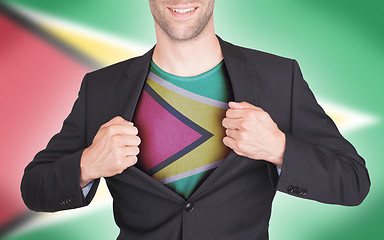 Image showing Businessman opening suit to reveal shirt with flag