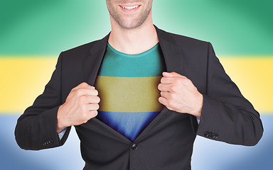 Image showing Businessman opening suit to reveal shirt with flag