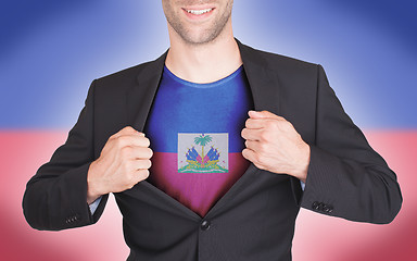 Image showing Businessman opening suit to reveal shirt with flag