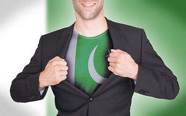 Image showing Businessman opening suit to reveal shirt with flag