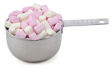 Image showing Pink and white mini marshmallows in an American cup measure