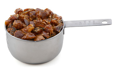 Image showing Chopped dates in an American cup measure