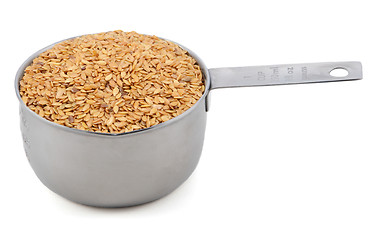 Image showing Golden linseed in an American cup measure