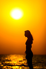 Image showing Woman silhouette at sunset