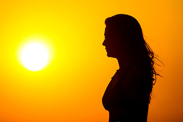 Image showing Woman watching sunset