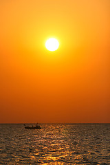 Image showing Boat sailing at sunset