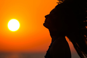 Image showing Young woman at sunset