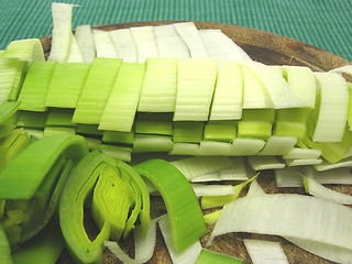 Image showing SLiced green leek on a wooden plate