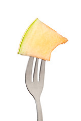 Image showing Cantaloupe held by a fork