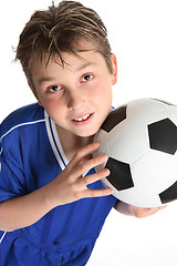 Image showing Boy holding a soccer ball