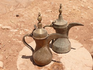 Image showing Stylish brass kettles, typical Jordanian craftmanship, Petra, Jordan