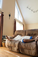 Image showing Lazy Man Laying on the Sofa