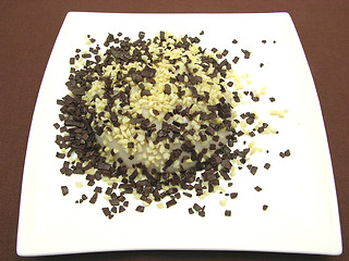 Image showing Almond pudding with chocolate granules and almond pieces