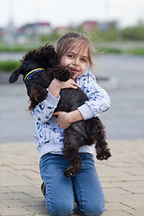 Image showing Little girl with her dog