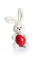 Image showing Stuffed easter bunny with red egg