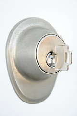 Image showing Metallic door lock with a key