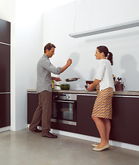 Image showing Young couple working in kitchen