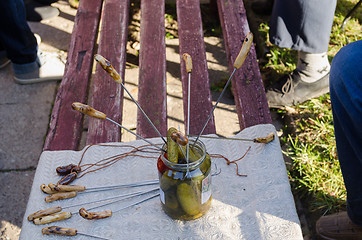 Image showing handmade metal spit to pull of jar vegetable 