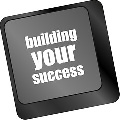 Image showing building your success words on button or key showing motivation for job or business