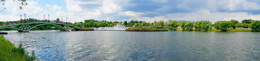 Image showing Summer Panorama: bridge over the river and fountain
