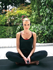 Image showing sporty girl sitting in yoga pose