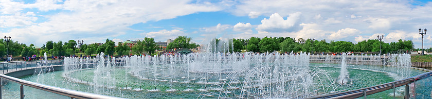 Image showing Panorama beautiful fountain against the blue sky with clouds