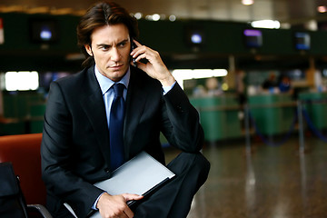 Image showing businessman in the airport mobile l